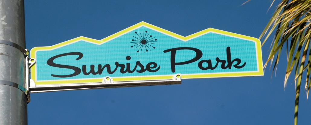 Sunrise Park blade sign on pole